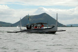 Banca passing in front of Binitiang Malaki on Volcano Island