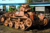 Japanese Type 95 Ha-Gō light tank rusting across from the Pacific War Museum