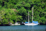 The sailboat Napilian anchored in the cove at Sams Tours