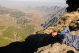 Keith looking over the edge at a sheer drop off