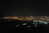 The lights of Sharjah from across the Palm Deira construction site