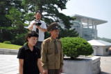 North Korean officer and the English translater being filmed by our groups cameraman