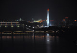 Juche Tower illuminated at night, from Yanggakdo Hotel