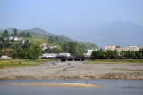 Railroad passing through a North Korean town on the opposite bank of the Chongchon River