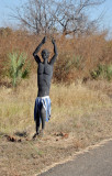 Roadside wooden sculpture of a man, Mfuwe