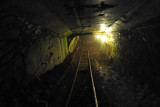 Tracks inside a tunnel descending to the lower levels of Minas da Passagem