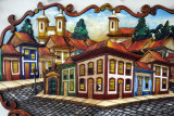Beautiful woodcarvings of city scenes of Ouro Preto - but I have so little wall space left
