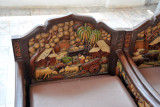 Carved and painted wooden chairs with a pastoral scene, Wat Saket