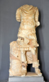 Marble statue of a headless male wearing a cuirass