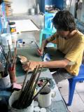 T-shirt painter at work, Trade Center, Male