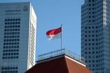 Singapores flag flying over Parliament