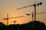 Sunset with construction cranes, Dubai