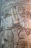Min, god of fertility, recognizable as 1 armed god with erect phallus
