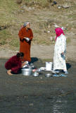 Women washing dishes along the river