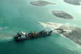 Ship spraying sand to build an island of The World