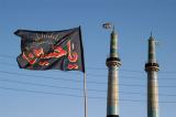 Ya-Hussein on a flag with the Jameh Mosque minarets