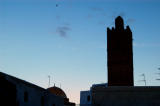 Minaret silhouetted against the darkening sky