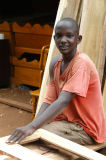 Young carpenter at work, Hoima Rd, Kampala