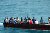 Tanzanian men on a motor launch, Zanzibar