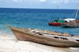 Wooden boat pulled up on the beach, Stone Town