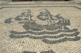 Praa Luis de Cames is covered with Lisbons typical sidewalk mosaics, here a Portuguese tall ship