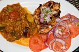 charcoal - grilled chicken breast with aji sauce, eggplant chorizo relish, tomato salad