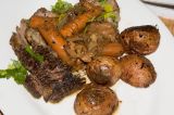 braised beef served with pan roasted red potatoes