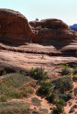 Lower down trail: one hiker going to the arch; four leaving