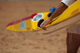 Surfer carrying surf kayak at Palm Beach surf carnival