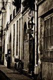 Bicycle leaning against wall in Paris 