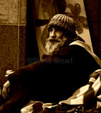 Homeless man at Quay in sepia