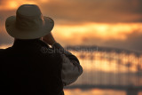 Man on ferry with Sydney Harbour Bridge backdrop