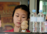 Pretty Asian girl selling ice cream