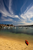 Manly Cove with single kayak and cirrus clouds