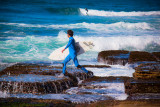 Surfer jumping rocks at Avalon web.jpg