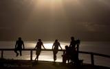 Group in silhouette Byron lighthouse