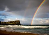Late afternoon rainbow at Avalon Beach