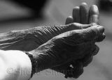 Hands of elderly lady at Quay
