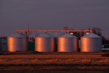 Sunset Reflection on Grain Bins
