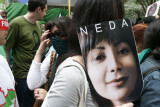 A protester at the UN carrying a poster of Neda Agha-Soltan