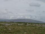 Terraced hillside in the distance, shaped by glaciers