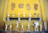 wall of statues and heads