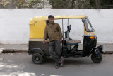 A driver with his auto-taxi