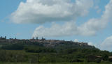 From the car, approaching Montalcino, fortress at left