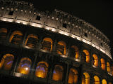 Colosseum at night.  Windows shuttered (!)