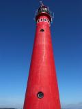 Red Lighthouse - Blue Sky by Roger Wilmot