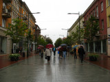 Umbrella-wielding locals on Vilniaus gatvė