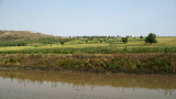 Fields rising away from the river bed