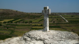 Stone cross and fields beyond