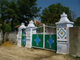 Another ornate gate outside a village house